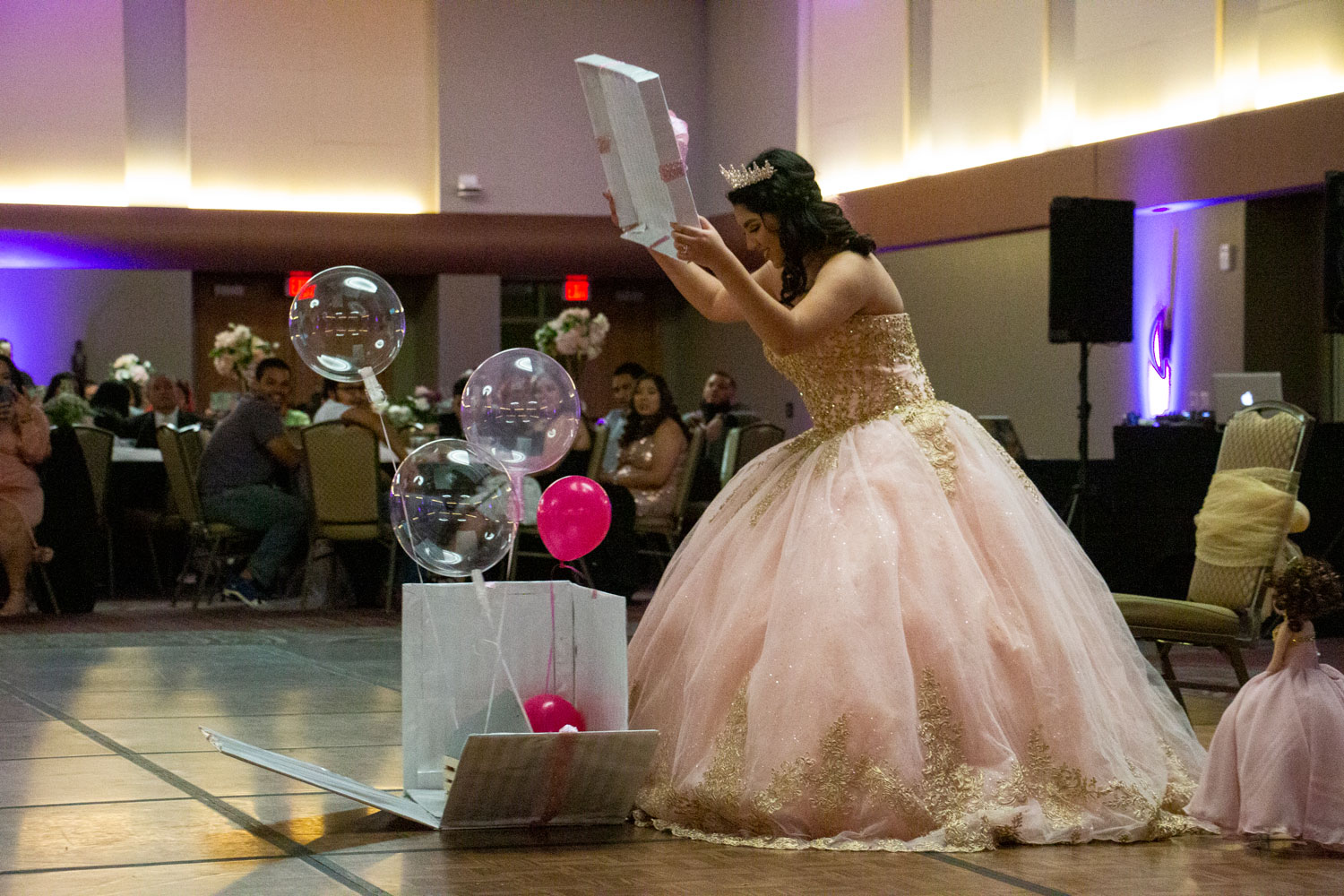 MeLeigha opening gifts during the ceremony while celebrating her Quince.