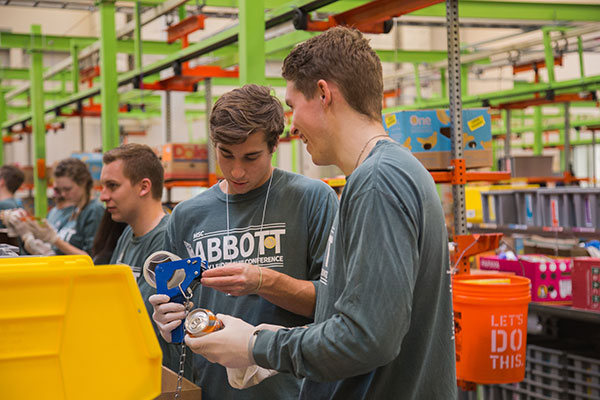 MSC Abbott students sorting canned goods as part of the volunteer aspect of the conference.