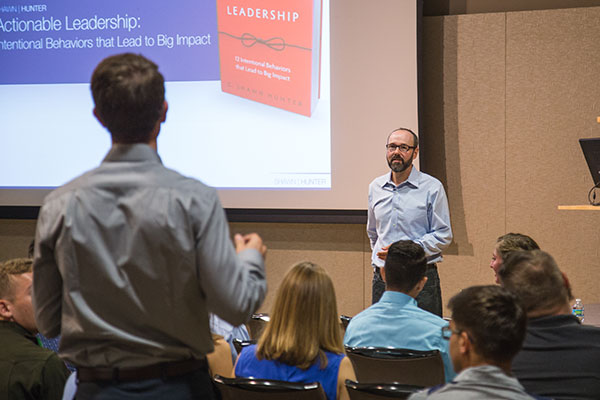 A student asking the MSC FLC keynote a speaker during the keynote address.