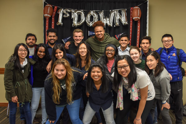 ISA students taking a group photo during their Football 101 program.