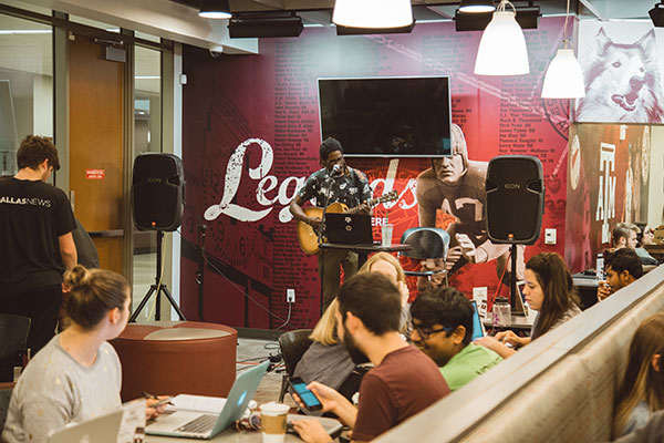 A local performer singing during an MSC Town Hall Coffeehouse.