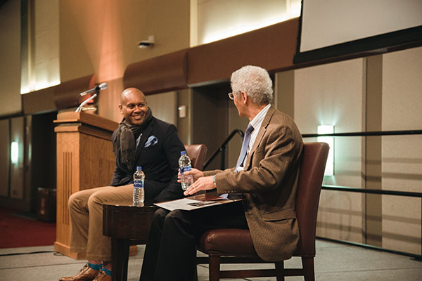 Photo from the MLK Breakfast, hosted by MSC WBAC where the moderator is asking the guest speaker a question.
